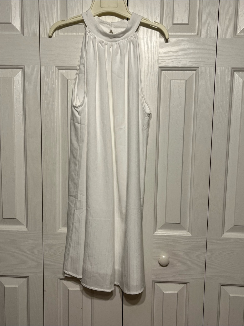 White halter type knee length dress.